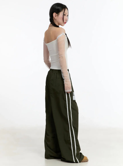 graphic-wide-leg-track-pants-cm511